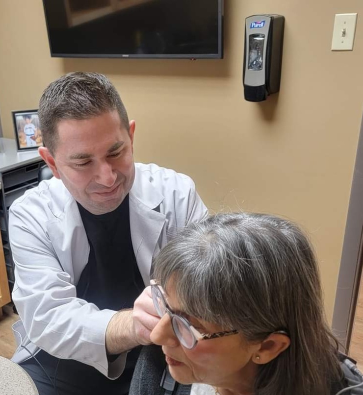 Dr. Mark Christian with patient at Audiology Associates of Deerfield