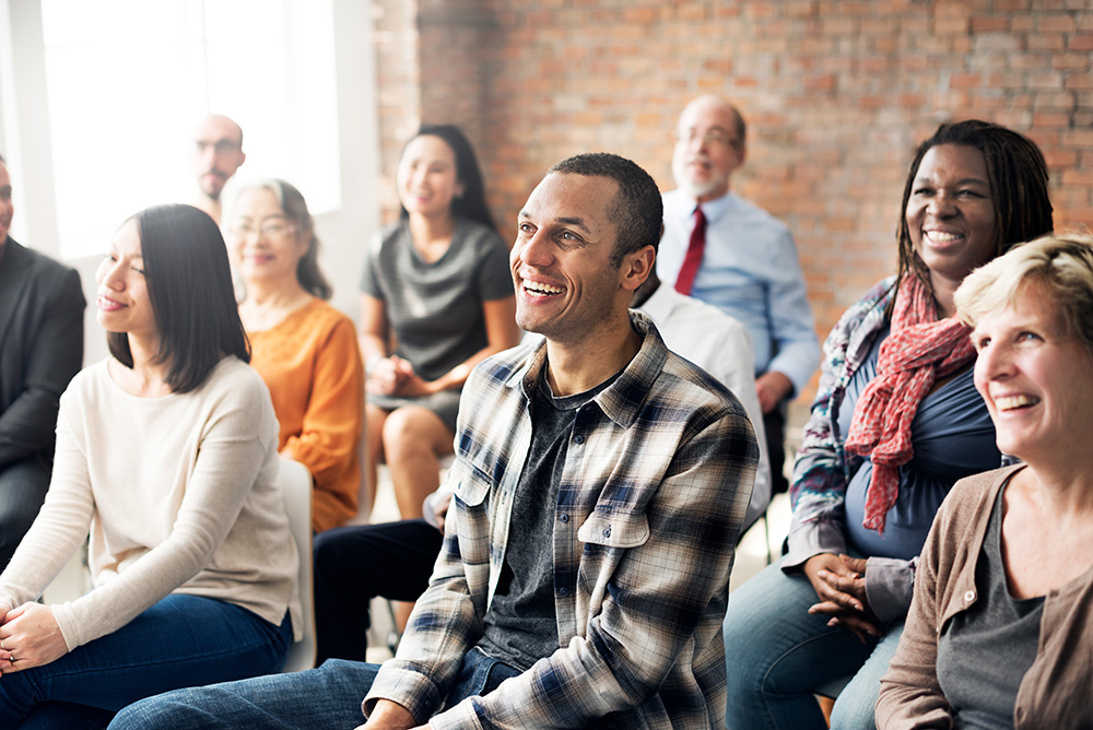 a group sitting listening to a presentation