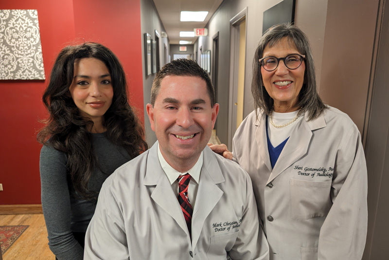 Dr. Gostomelsky, Dr. Christian and Daisy smiling at the camera