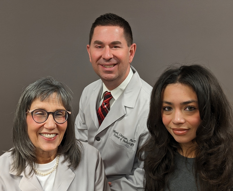 Dr. Gostomelsky, Dr. Christian and Daisy smiling at the camera